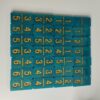 Jeu de dominos bleu-vert à chiffres dorés
