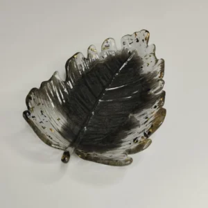 Vide-poche en forme de fleur avec couleurs noires et transparentes, parfait pour ranger des petits objets.