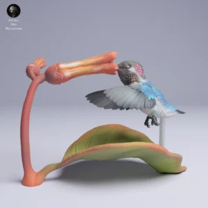 Figurine détaillée d'un colibri sur une fleur stylisée, 50mm x 73mm, parfaite pour dioramas et modélisme.