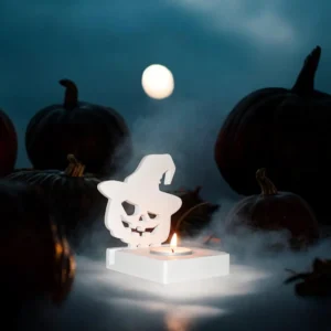 Bougeoir Halloween en Jesmonite (7,5x9,5x11,5 cm) en forme de citrouille avec chapeau de sorcière, lumière traversant les yeux et la bouche.