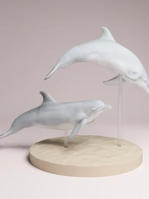 figurine-dauphins-resine-saut Une figurine de deux dauphins en plein saut hors de l'eau, fabriquée en résine à l'échelle 1/48, prête à être peinte pour un décor réaliste.