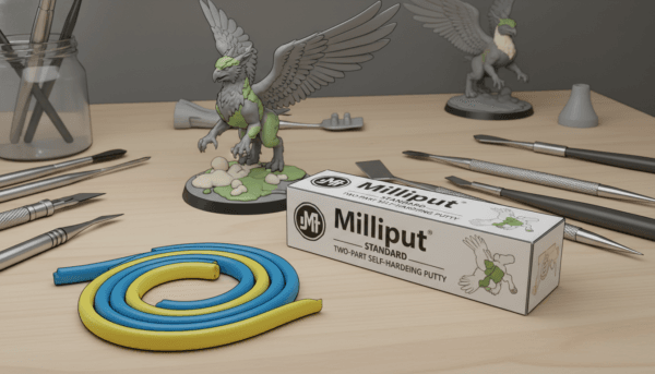 A high-quality close-up photograph of a hobbyist's workbench featuring a roll of blue and yellow epoxy putty (Green Stuff) and a box of Milliput Standard, with a small animal miniature partially assembled in the background.