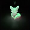 Veilleuse originale renard brillant en vert fluo dans l'obscurité.