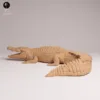 miniature-crocodile-resine-profil-ecaille Miniature crocodile résine non peinte montrant les détails des plaques ostéodermiques et la texture de la peau.