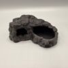 bol-pour-reptile-2-en-1-detail Détail de l'intérieur lisse et du surplomb rocheux protecteur de ce bol pour reptile 2-en-1.