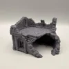 Abri thématique pour terrarium montrant les détails de pierre sculptée et la large grotte d'accès inférieure.