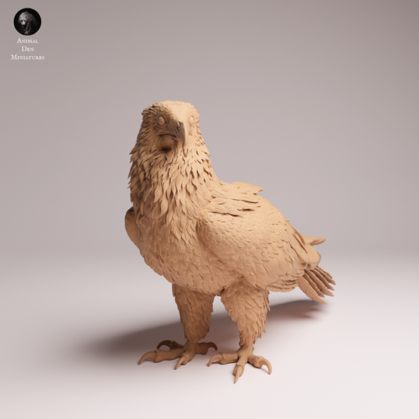 Statuette de gypaète barbu issue d'une impression 3D haute précision posée sur un plan de travail de modélisme.