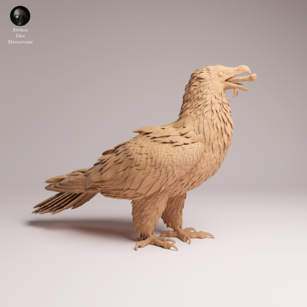 statuette-gypaete-barbu-impression-3d Statuette de gypaète barbu issue d'une impression 3D haute précision posée sur un plan de travail de modélisme.