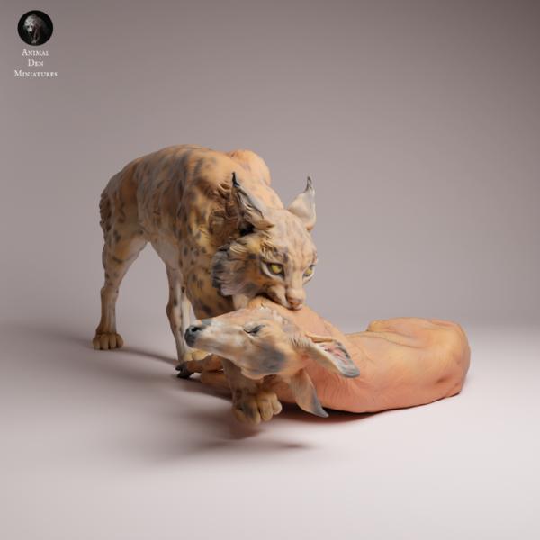 Vue globale de la figurine à peindre d'un lynx boréal dominant un faon couché, illustrant la tension de la scène sauvage.