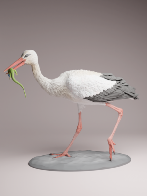 figurine-cigogne-blanche-chasse-lezard Figurine de cigogne blanche à peindre, debout sur un sol sableux, tenant fermement un lézard vert dans son long bec, montrant une posture de chasse dynamique.